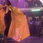 Dominique Jackson walks in a yellow cape during a ball in this image from FXP.