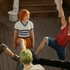 The iconic "feet on the barrel scene" with Luffy, Zoro, Nami, Usopp, and Sanji from Netflix