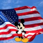 Mickey Mouse in front of the American Flag