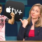 Bridget Carey gestures towards Lionel Messi with her thumb