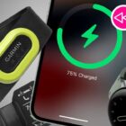 A Garmin heart-rate monitor, iPhone and Google Pixel Watch on a grey background