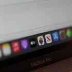 MacBook Pro showing Apple TV logo and pixelmator