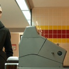 Still from 'Loki' Season two, featuring Loki and Sylvie in a vintage McDonald's looking at each other