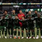 The Portland Timbers pose together for a photo.