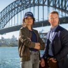 BTS of Olivia Swann as NCIS Special Agent Captain Michelle Mackey and Todd Lasance as AFP Liaison Officer Sergeant Jim  'JD' Dempsey, on the set of NCIS: Sydney season 1. PHOTO CREDIT: Daniel Asher Smith/Paramount+   © TM & © 2023 CBS Studios Inc. NCIS: Sydney and related marks and logos are trademarks of CBS Studios Inc. All Rights Reserved.