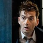 David Tennant as the Doctor in the 60th anniversary special of 'Doctor Who', standing in the doorway of the TARDIS
