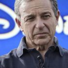 Bob Iger with Disney logo