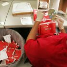 Louis Jijon of Worcester, an associate at Netflix, works on the rental returns on Wednesday, August 15, 2007.