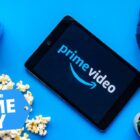 A tablet with the Prime Video logo surrounded by items and a Prime Day badge in the lower left corner