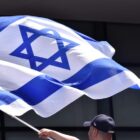 People hold and wave Israel flags during a rally in solidarity with the people of Israel, in Bogota, Colombia, October 9, 2023. After the shocking and deadly attack on Israel by the Palestinian militant group Hamas on October 7, the group, responsible for dragging off approximately 150 hostages in its surprise weekend assault on southern Israel, issued a threat on Monday. The threat conveyed Hamas's intention to kill the hostages if Israeli air strikes persisted in targeting Gaza residents without prior warning. This ominous development followed Israel's imposition of a complete siege on the Gaza Strip, leading to the cutting off of the water supply. This action raised concerns within the United Nations about the escalating humanitarian crisis in the region. (Photo by: Cristian Bayona/Long Visual Press/Universal Images Group via Getty Images)
