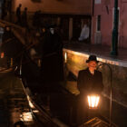 Riccardo Scamarcio as Vitale Portfoglio and Kenneth Branagh as Hercule Poirot in 20th Century Studios' A HAUNTING IN VENICE.
