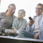 Parents and son watching tv