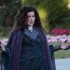 Agatha Harkness looks confused with arms outstretched in WandaVision