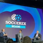 MLS commissioner Don Garber (left) and Apple senior vice president of services Eddy Cue (right) discuss Lionel Messi’s effect on the league, and other topics, at Soccerex conference in Miami Nov. 14, 2023.