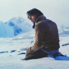 A man looks forlorn in the snow in the Netflix movie Society of the Snow