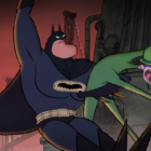Cartoon Batman swinging around with cartoon Riddler in hand.