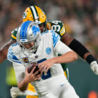 GREEN BAY, WISCONSIN - SEPTEMBER 28: Karl Brooks #94 of the Green Bay Packers sacks Jared Goff #16 of the Detroit Lions during the third quarter in the game at Lambeau Field on September 28, 2023 in Green Bay, Wisconsin. (Photo by Patrick McDermott/Getty Images)