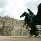giant winged creature towers above crouched human