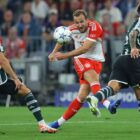 Harry Kane (C) strikes the ball ahead of the Man Utd vs Bayern Munich live stream