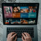 macbook pro on white table streaming