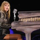 Taylor Swift plays piano during Reputation stadium tour