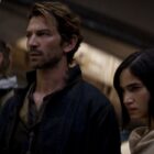 Kai, Gunnar, and Kora stare down someone off-screen in Rebel Moon Part 1