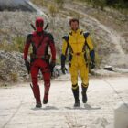 (L, R) Deadpool and Hugh Jackman as Wolverine, walking on a dirt road in Deadpool 3