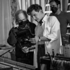 Producer Steven Spielberg and Writer/Director/Producer Bradley Cooper as Leonard Bernstein on the set of 