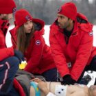 The cast of SkyMed season 2 attend to a patient in on a snowy mountain top