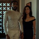 A bloodied John and Jane Smith stand in a doorway in Mr. and Mrs. Smith on Prime Video