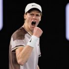 Jannik Sinner of Italy, wearing a light-colored Nike baseball cap, celebrates getting through to the Sinner vs Medvedev Australian Open final 2024. 