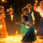The Madrigal family in Mirabel dream sequence in Encanto waiting for a miracle