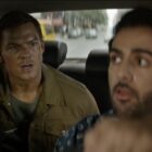 Alan Ritchson in Reacher Season 1 speaking to taxi driver.