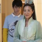 AMERICAN BORN CHINESE, from left: Jimmy Liu, Michelle Yeoh, 'What Guy Are You', (Season 1, ep. 101, aired May 23, 2023). photo: Carlos Lopez-Calleja / ©Disney+ / Courtesy Everett Collection