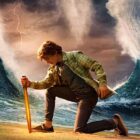 Percy Jackson from Disney+ series in front of waves