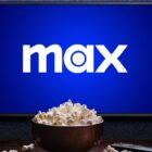 Max logo on TV with popcorn and remote control on table 