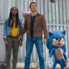 Maddie (Tika Sumpter), Tom (James Marsden), and Sonic (Ben Schwartz) face down Robotnik's drones in Sonic the Hedgehog