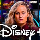 Brie Larson as Captain Marvel in front of Marvel movies, Disney Plus logo