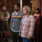 Jay (Utkarsh Ambudkar) and Sam (Rose McIver) flanked by some of the ghost cast in Ghosts US season 3
