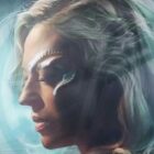 a portrait of a woman with long hair and a metal implant on her face circling one eye