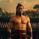warrior man stands shirtless and looks ahead