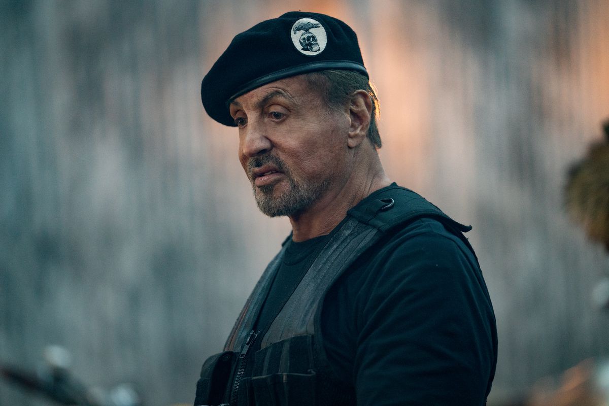 A midshot of Sylvester Stallone wearing a black beret and vest in the film Expend4bles
