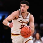 Jalen Quinn of the Loyola Ramblers dribbles the basketball
