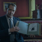 Ben Mendelsohn as Christian Dior, showing off a new design.