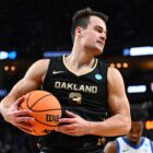 Jack Gohlke #3 of the Oakland Golden Grizzlies controls the ball ahead of the NC State vs Oakland March Madness 2024 game.