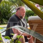 Alex Jones Relaxing in Hawaii, Still Owes Millions to Sandy Hook Families