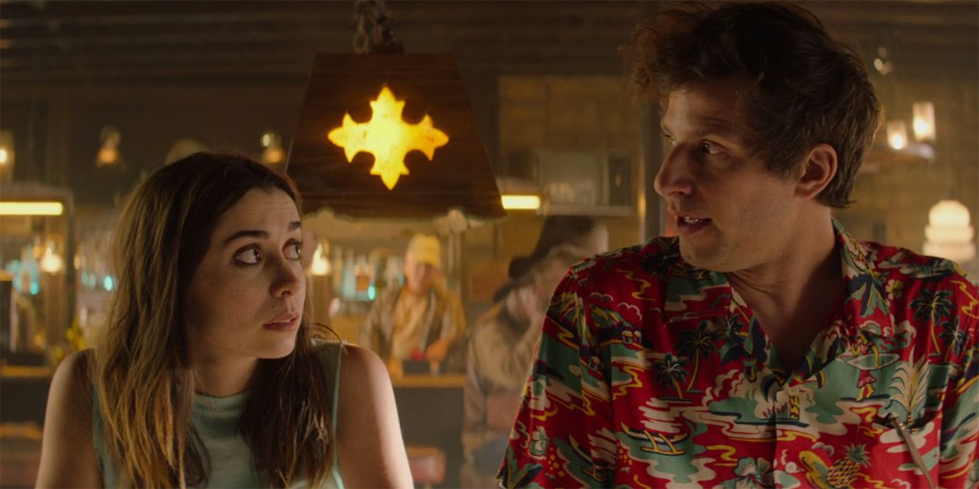 Andy Samberg as Nyles and Cristin Milioti as Sarah Wilder looking inquisitively at one another in Palm Springs