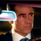 Colin Farrell as private detective John Sugar, wearing a suit and sitting in a car whilst looking pensive in new Apple TV show 