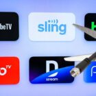 The YouTube TV, Sling TV, Hulu, Philo, DirecTV Stream and FuboTV logos appear on a screen with a scissors cutting a coaxial cable wire in front.