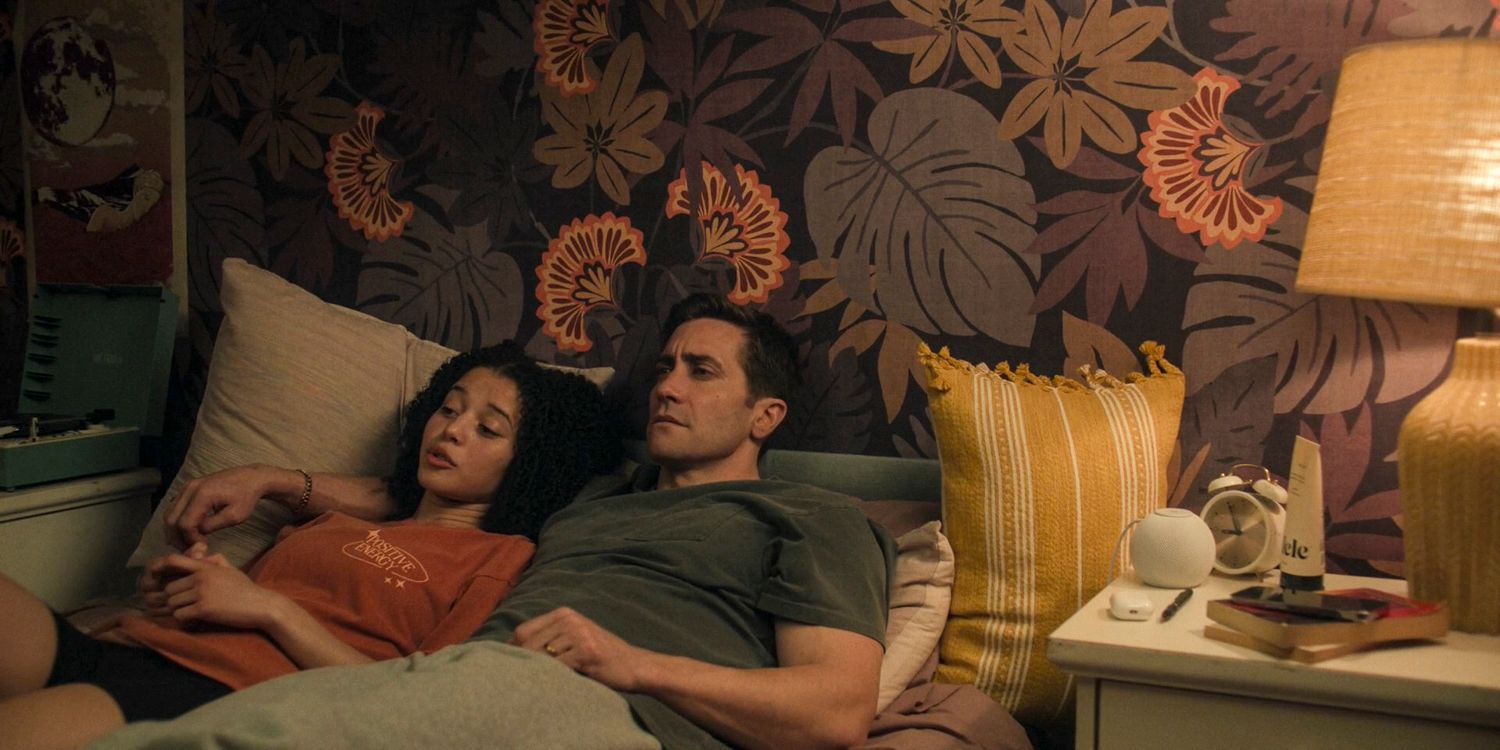 Rusty (Jake Gyllenhaal) and Jaden (Chase Infiniti) are lying in bed chatting in Presumed Innocent season 1 episode 5